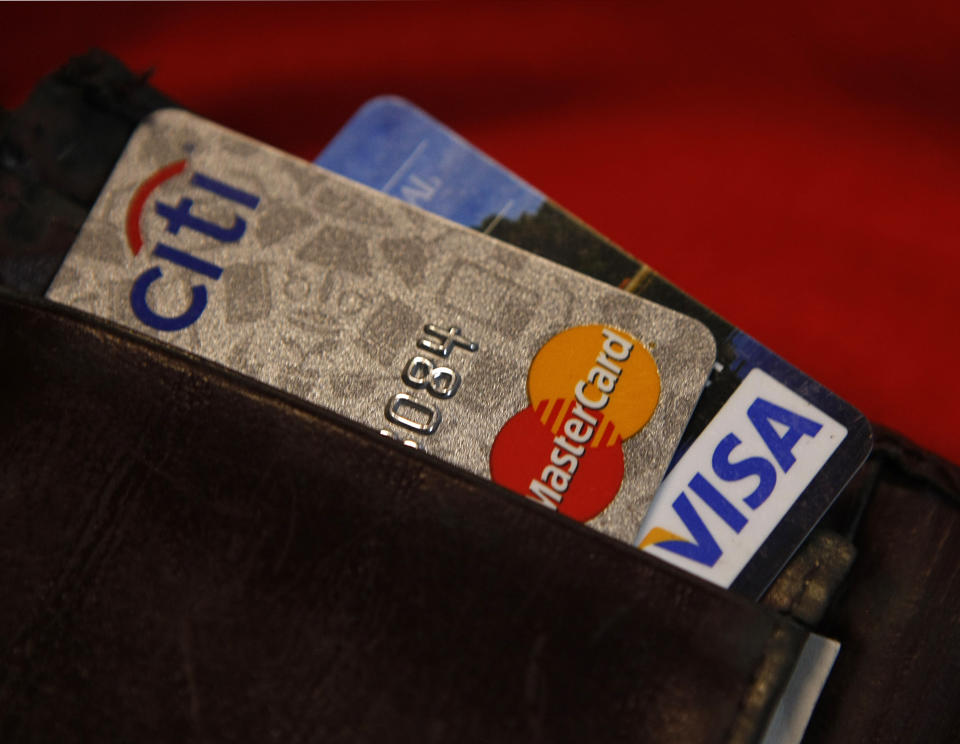 Credit cards are pictured in a wallet in Washington, February 21, 2010. Credit card rules that come into effect on Monday will squeeze subprime borrowers' access to credit, analysts say, which could give a lift to the shadow banking sector and payday lenders.This second round of provisions from legislation known as the CARD act, signed into law in May, will significantly affect how card issuers earn money by restricting their ability to charge fees and raise rates, especially on existing balances. REUTERS/Stelios Varias (UNITED STATES - Tags: BUSINESS)