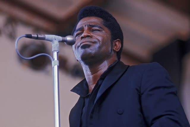 <p>Hulton Archive/Getty </p> James Brown performs in 1968