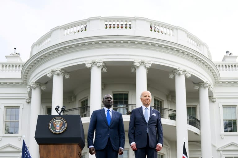 US President Joe Biden (R) and Kenya's President William Ruto stand as national anthems are played during an official arrival ceremony on the South Lawn of the White House in Washington, DC (Mandel NGAN)