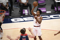 Cleveland Cavaliers guard Collin Sexton (2) shoots against Washington Wizards center Robin Lopez, bottom, during the second half of an NBA basketball game, Friday, May 14, 2021, in Washington. The Wizards won 120-105. (AP Photo/Nick Wass)