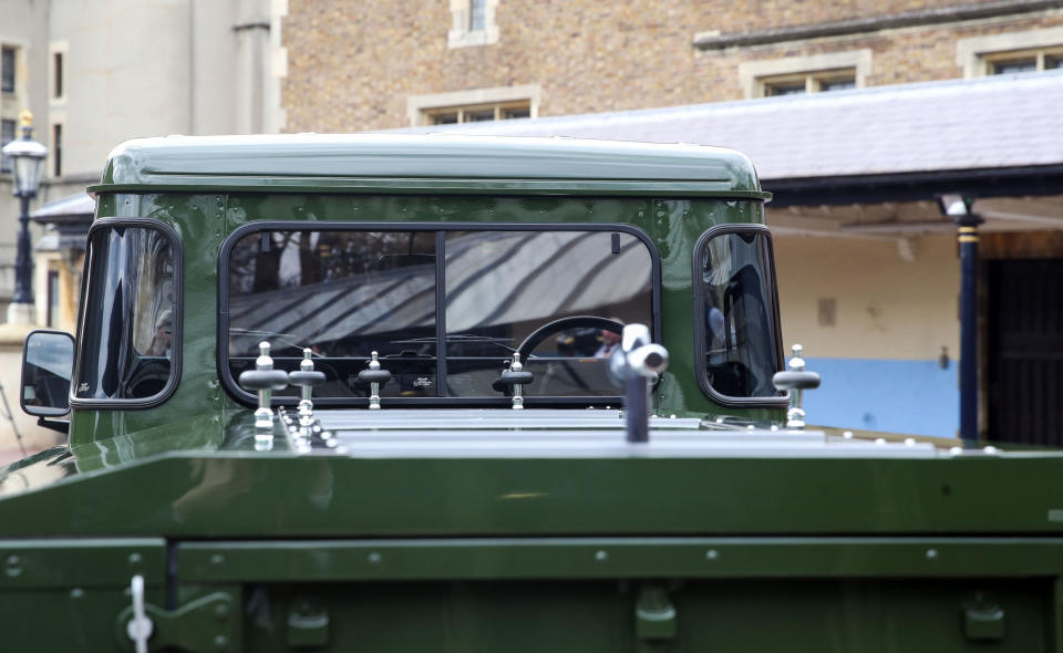 The Jaguar Land Rover that will be used to transport the coffin of the Duke of Edinburgh at his funeral on Saturday, is pictured at Windsor Castle, in Berkshire, England, Wednesday, April 14, 2021. The modified Land Rover Defender TD5 130 chassis cab vehicle was made at Land Rover's factory in Solihull in 2003 and Philip oversaw the modifications throughout the intervening years, requesting a repaint in military green and designing the open top rear and special "stops" to secure his coffin in place. (Steve Parsons/Pool Photo via AP)