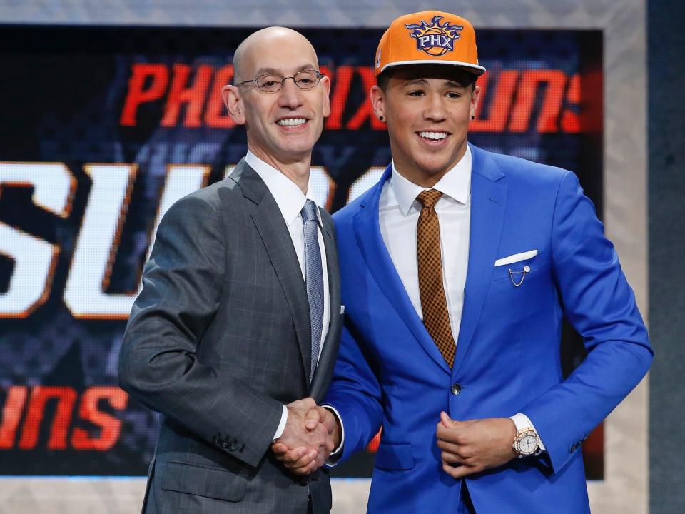 Devin Booker poses with Adam Silver at the 2015 draft.