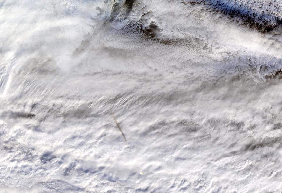 The Terra satellite's Moderate Resolution Imaging SpectroRadiometer (MODIS) instrument snapped this true-color photo showing remnants of the Dec. 18 meteor's passage. (Photo: NASA/GSFC)