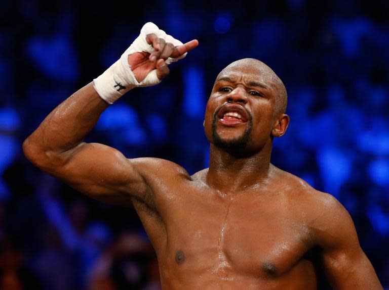 Floyd Mayweather continues to taunt Conor McGregor by labelling Tyron Woodley 'the best UFC fighter'