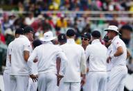 England's captain Alastair Cook (4th R) talks to his team on the Adelaide Cricket Ground before the first day's play of the second Ashes test cricket match against Australia in Adelaide December 5, 2013.