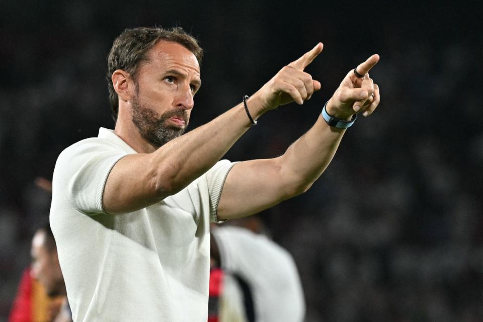 Gareth Southgate gestures to England fans after the Slovenia draw (AFP via Getty Images)