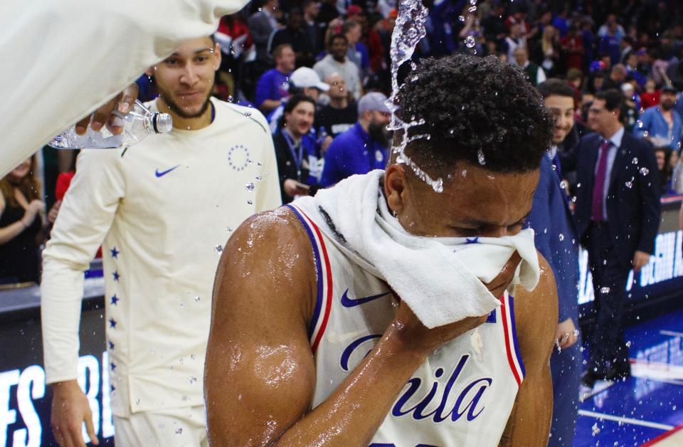 Markelle Fultz’s teammates made the most of his triple-double moment, mobbing him and dousing him with water after the game. (AP)