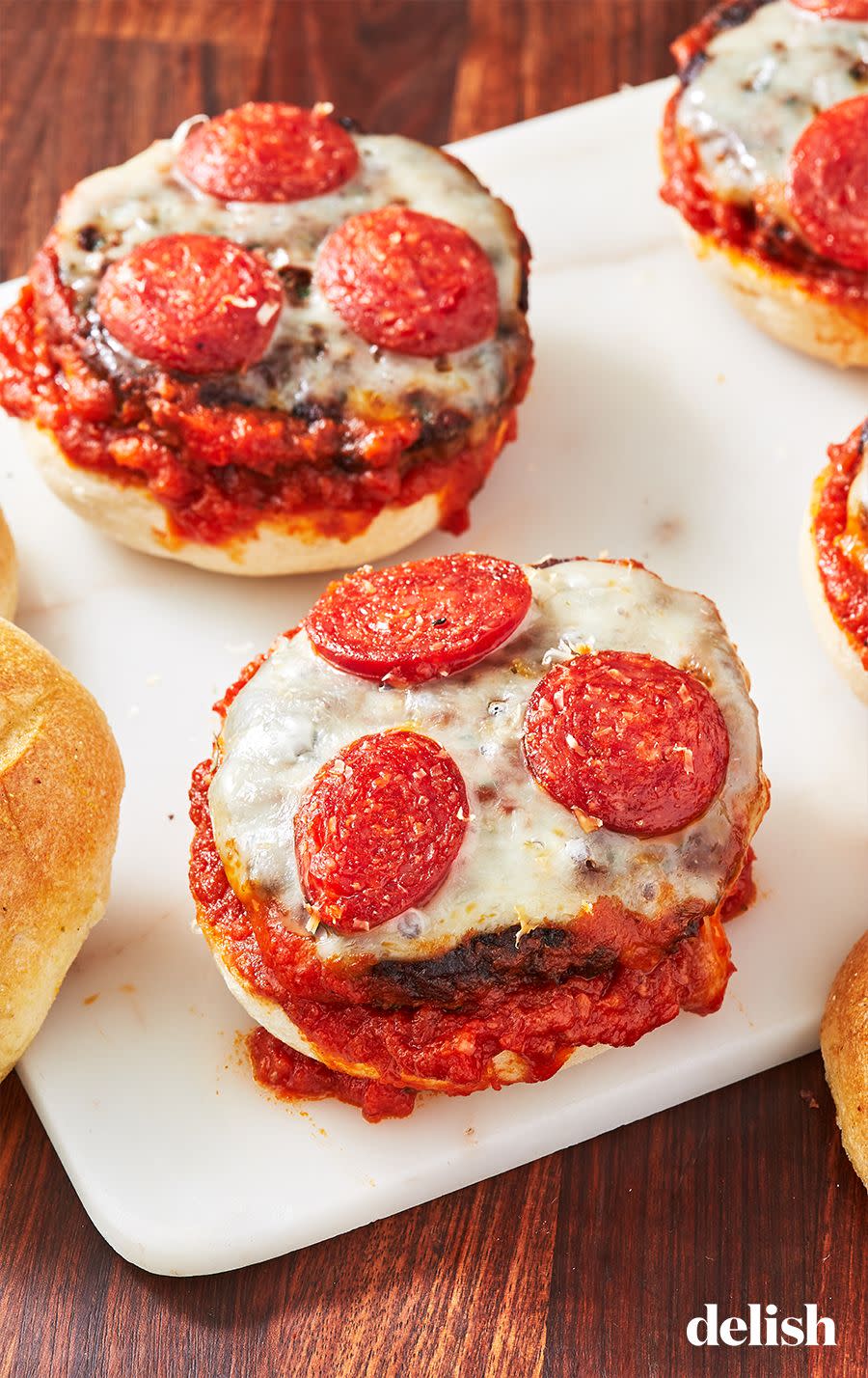 <p>Two faves in one!</p><p>Get the recipe from <a href="https://www.delish.com/cooking/recipe-ideas/recipes/a47675/pizza-burgers-recipe/" rel="nofollow noopener" target="_blank" data-ylk="slk:Delish;elm:context_link;itc:0;sec:content-canvas" class="link ">Delish</a>.</p>