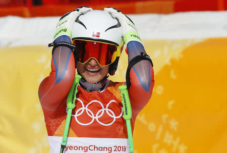 Ragnhild Mowinckel of Norway reacts after her run in women's downhill alpine skiing. REUTERS/Leonhard Foeger