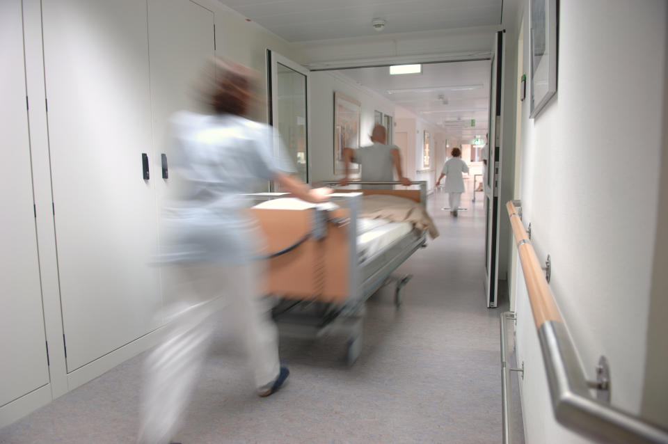 hospital surgery nurses prep bed