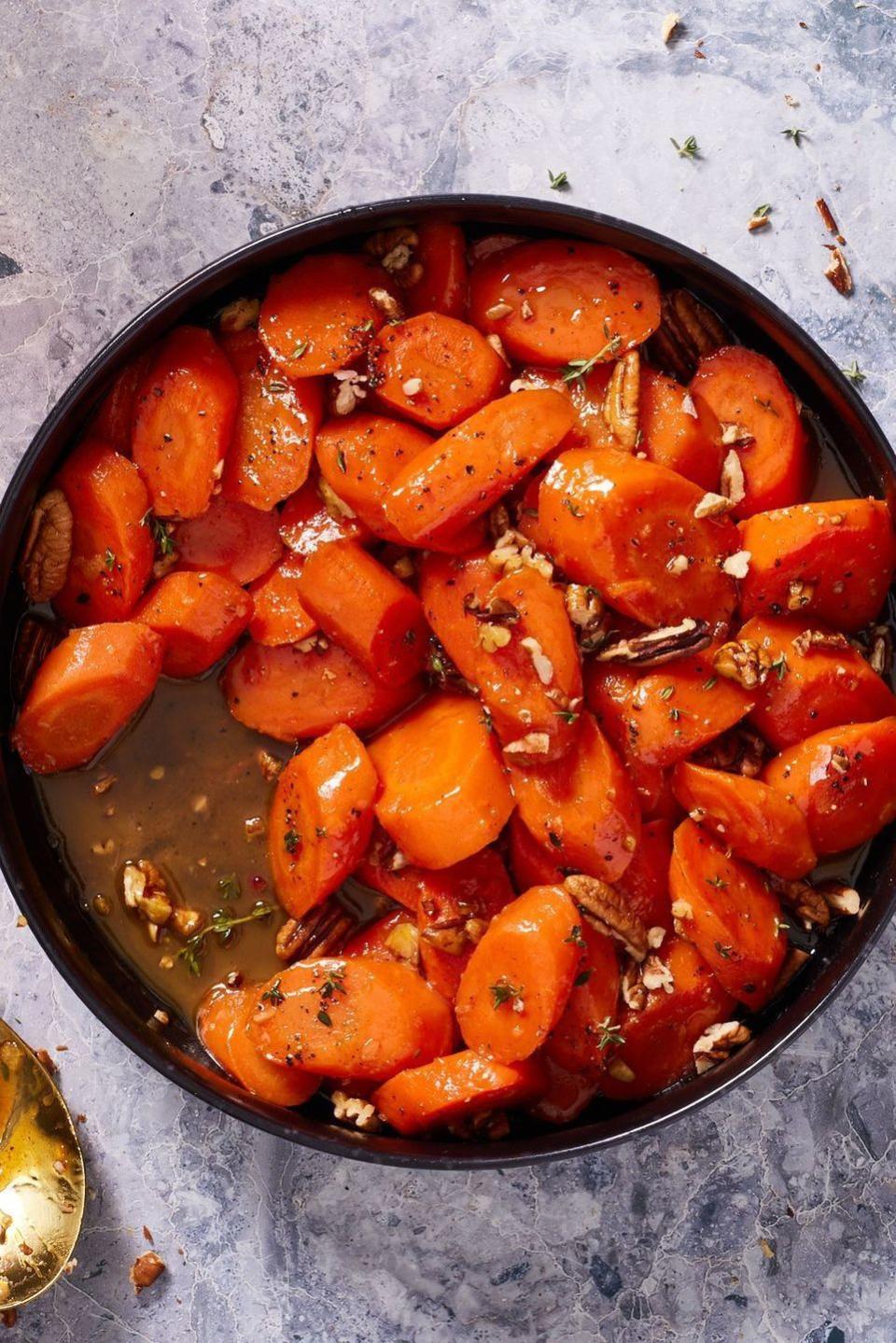 <p>Just a heads up: Any dish that features the word “candied” is bound to be on the sweet side and more than likely something you won’t be eating every day. That said, don’t be shy about the amount of butter and brown sugar that goes into these candied carrots: Decadence is the goal here!<br><br>Get the <strong><a href="https://www.delish.com/cooking/recipe-ideas/a39386021/candied-carrots-recipe/" rel="nofollow noopener" target="_blank" data-ylk="slk:Candied Carrots recipe;elm:context_link;itc:0;sec:content-canvas" class="link ">Candied Carrots recipe</a></strong>.</p>