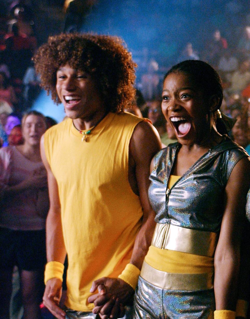 Keke and Corbin Bleu holding hands in Jump In