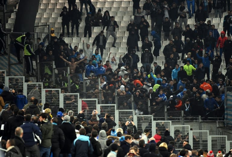 Marseille and Montpellier supporters shout at each other during the match at the Velodrome stadium in Marseille, southern France, on January 20, 2016