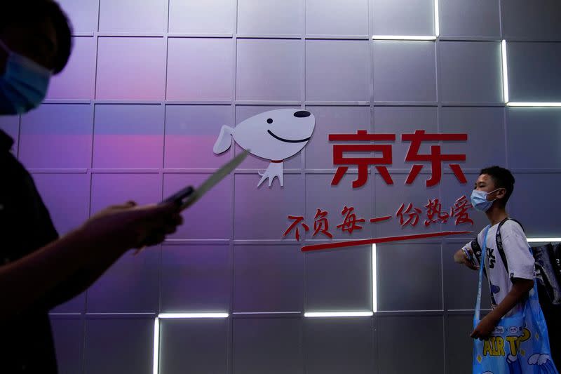 FILE PHOTO: A sign of JD.com is seen at the China Digital Entertainment Expo and Conference, also known as ChinaJoy, in Shanghai