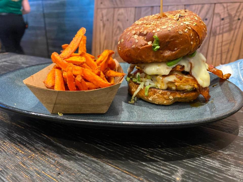 The chicken avocado club with sweet potato fries at Walk-On’s Sports Bistreaux in Wichita