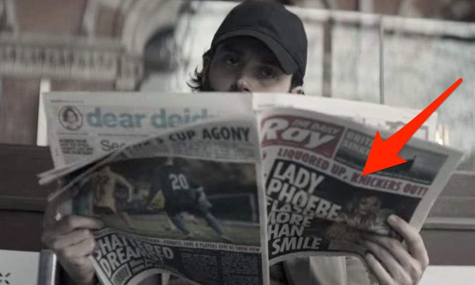 joe holding newspaper about lady phoebe