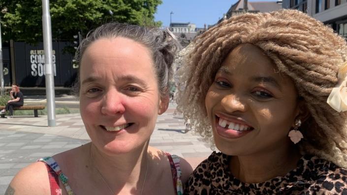 Cathryn McShane-Kouyat&#xe9; and Tijesunimi Olakojo smiling in Cardiff town centre