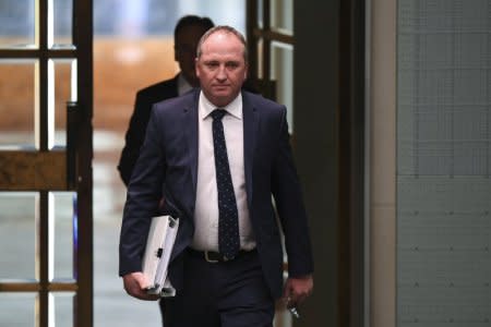 Australian Deputy Prime Minister Barnaby Joyce arrives during House of Representatives Question Time at Parliament House in Canberra, Australia, February 13, 2018. AAP/Lukas Coch/via REUTERS