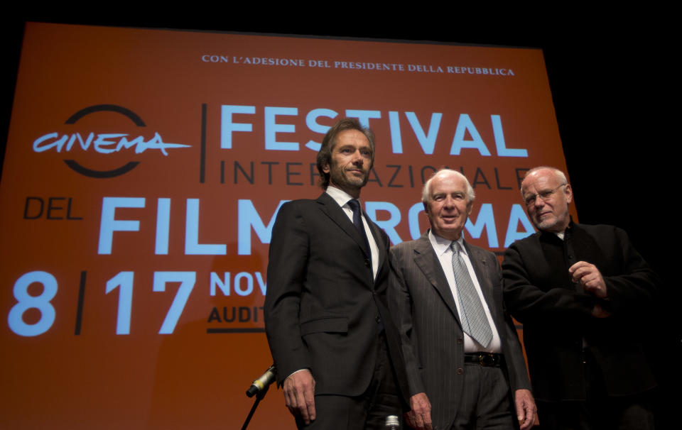 From left, Lamberto Mancini and Paolo Ferrari, General Director and President of "Fondazione Cinema per Roma", and Rome Film Festival artistic director Marco Muller pose for photographers before they present the 8th edition of the Rome Film Festival at Rome's auditorium, Monday, Oct. 14, 2013. The Festival opens on Nov. 8 and will go on until Nov. 17. (AP Photo/Alessandra Tarantino)