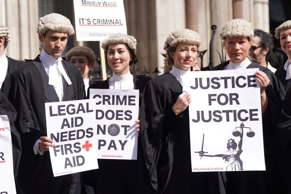 Criminal defence barristers gather outside the Royal Courts of Justice in London to support the ongoing Criminal Bar Association action over Government set fees for legal aid advocacy work (Kirsty O’Connor/PA) (PA Wire)