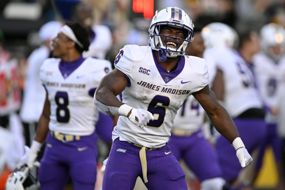 BOONE, NORTH CAROLINA - SEPTEMBER 24: Kaelon Black #6 of the James Madison Dukes celebrates in the last few seconds of the fourth quarter against Appalachian State Mountaineers at Kidd Brewer Stadium. (Photo by Eakin Howard/Getty Images)