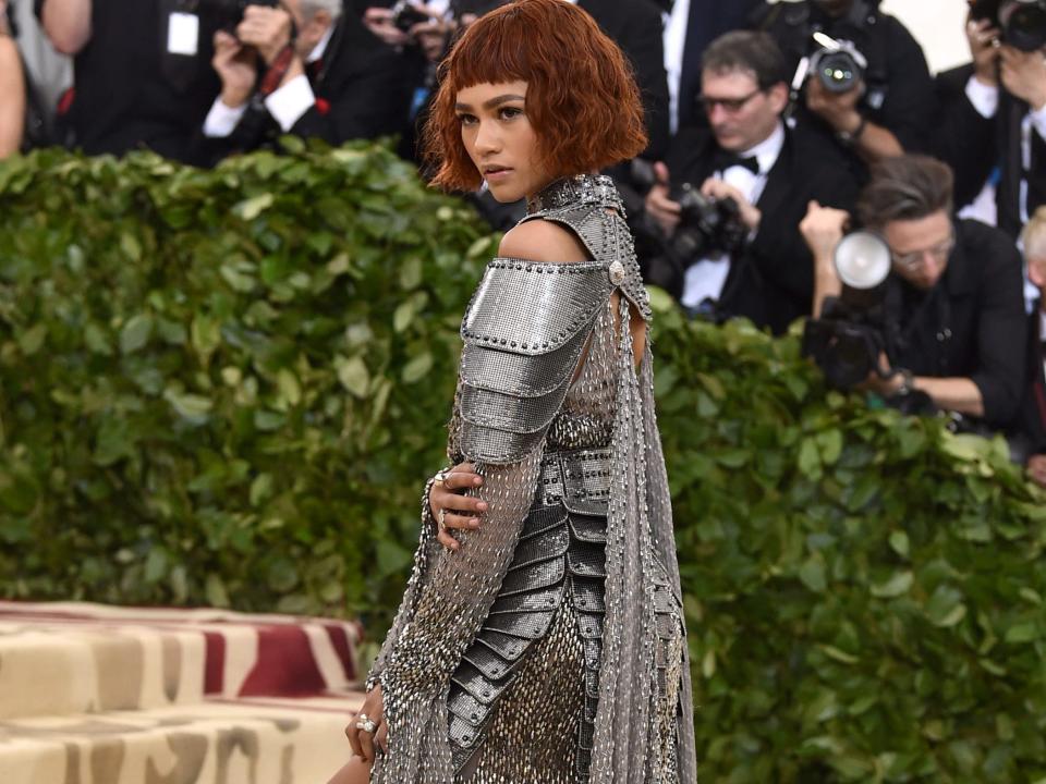 Zendaya wearing a silver Versace dress at the 2018 Met Gala.