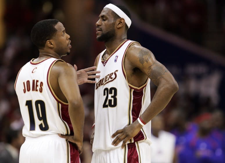 Cleveland Cavaliers' Damon Jones (19) and LeBron James confer late in Game 6 of the NBA basketball Eastern Conference finals against the Detroit Pistons Saturday, June 2, 2007, in Cleveland. (AP Photo/Mark Duncan)