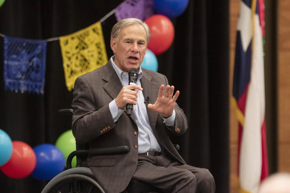 Gov. Greg Abbott speaks on a variety of matters including a border wall, razor wire, critical race theory, Election laws, mail in ballots, voter fraud, and more at the Midland Chapter of the Republican National Hispanic Assembly's Reagan Lunch at the Bush Convention Center Friday, Nov. 5, 2021, in Midland, Texas. (Jacob Ford/Odessa American via AP)