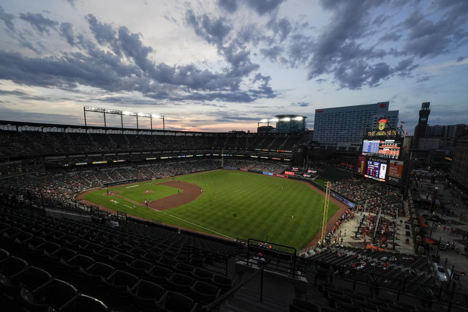 A crowd watches the fifth inning of a baseball game between the Baltimore Orioles and the Toronto Blue Jays, Friday, June 18, 2021, in Baltimore. (AP Photo/Julio Cortez)