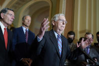 Senate Minority Leader Mitch McConnell, R-Ky., joined from left by Sen. John Barrasso, R-Wyo., left, and Minority Whip John Thune, R-S.D., speaks to reporters after a Republican strategy meeting at the Capitol in Washington, Tuesday, Oct. 19, 2021. (AP Photo/J. Scott Applewhite)