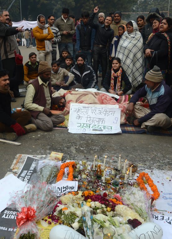 Indian residents gather to pray for a gang-rape victim during a silent protest in New Delhi on January 1, 2013. Police arrested a man on Tuesday as he tried to plant a crude bomb near the home of one of the suspects in the New Delhi gang-rape case as a backlash against widespread sex crimes gathered steam