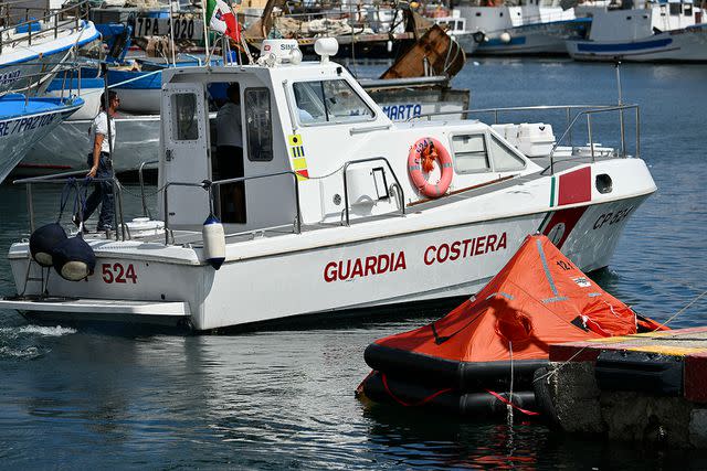 <p> ALBERTO PIZZOLI/AFP via Getty Images</p> A life boat searching for the passengers who were aboard the 'Bayesian'