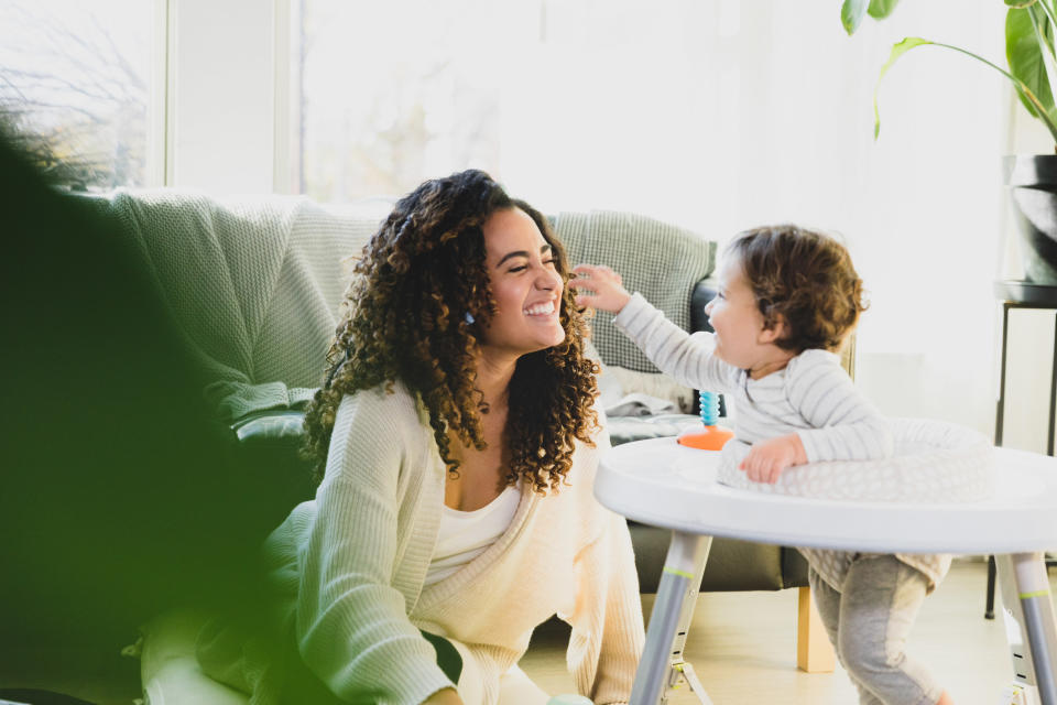 A babysitter playing with a child