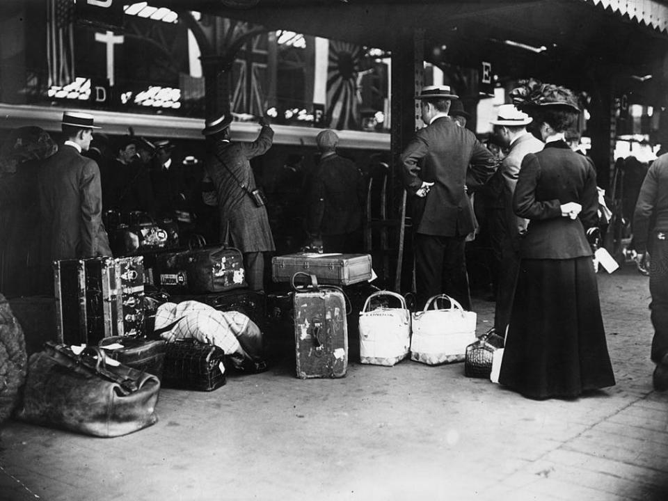 Passengers waiting with their luggage to board the first special passenger train to London.