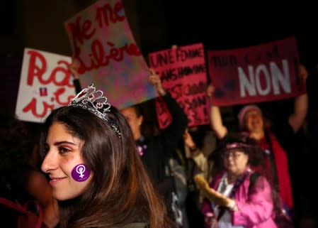 A woman smiles at the start of a women's strike in Lausanne