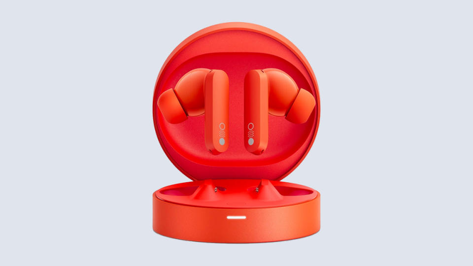 CMF by Nothing; orange earbuds in an orange case