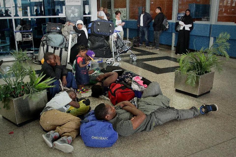 Passengers wait for flights to resume after the national carrier, EgyptAir, canceled all international flights out of Cairo because of a strike by the airline's flight attendants in Cairo, Egypt, Friday, Sept 7, 2012. Hundreds of passengers crowded into the airport on Friday, some protesting the disruption of their travel plans. EgyptAir estimated its losses from the canceled flights by midday at $10 million. (AP Photo/Jihan Nasr, Al Shorouk newspaper)