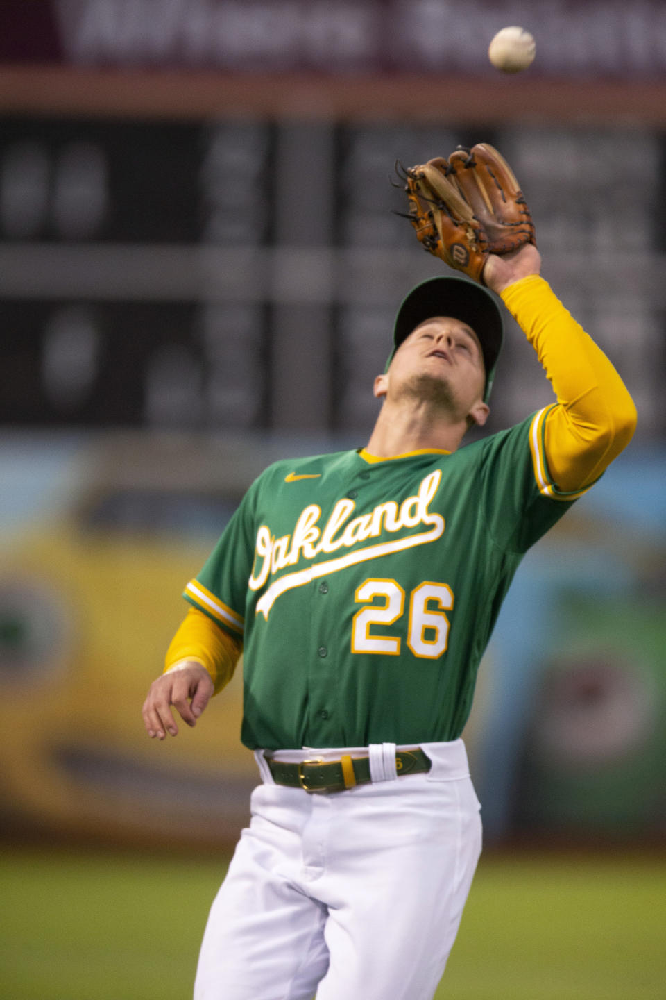 Oakland Athletics third baseman Matt Chapman catches a pop foul by Texas Rangers' Yonny Hernandez during the fifth inning of a baseball game Friday, Aug. 6, 2021, in Oakland, Calif. (AP Photo/D. Ross Cameron)