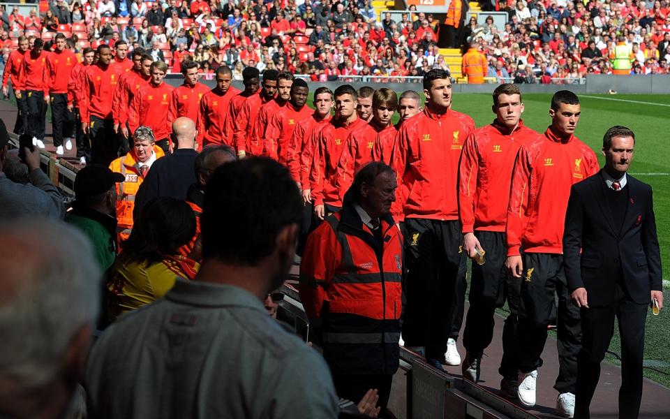 Alex Inglethorpe leads the Liverpool Academy players to the 25th Hillsborough Anniversary Memorial Service at Anfield on April 15, 2014