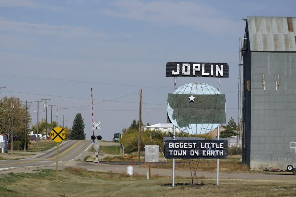 A welcome sign for the town of Joplin, Mont., is shown Monday, Sept. 27, 2021. An Amtrak train derailed Saturday near the town, killing three people and injuring others. Federal investigators are seeking the cause of the derailment. (AP Photo/Ted S. Warren)