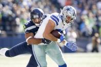 FILE PHOTO: Sep 23, 2018; Seattle, WA, USA; Dallas Cowboys tight end Geoff Swaim (87) is tackled by Seattle Seahawks linebacker Mychal Kendricks (56) after making a reception during the third quarter at CenturyLink Field. Mandatory Credit: Joe Nicholson-USA TODAY Sports/File Photo