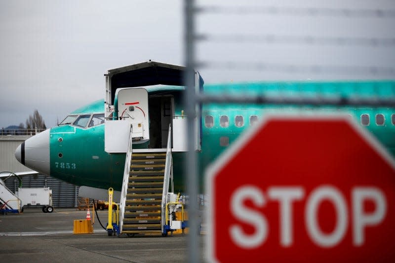 FILE PHOTO: A Boeing 737 Max aircraft sits on the tarmac at Boeing's 737 Max production facility in Renton, Washington, U.S. December 16, 2019. REUTERS/Lindsey Wasson