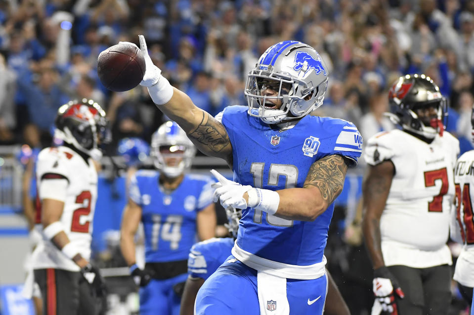 Detroit Lions running back Craig Reynolds reacts after scoring on a run against the Tampa Bay Buccaneers during the second half of an NFL football NFC divisional playoff game, Sunday, Jan. 21, 2024, in Detroit. (AP Photo/Jose Juarez)