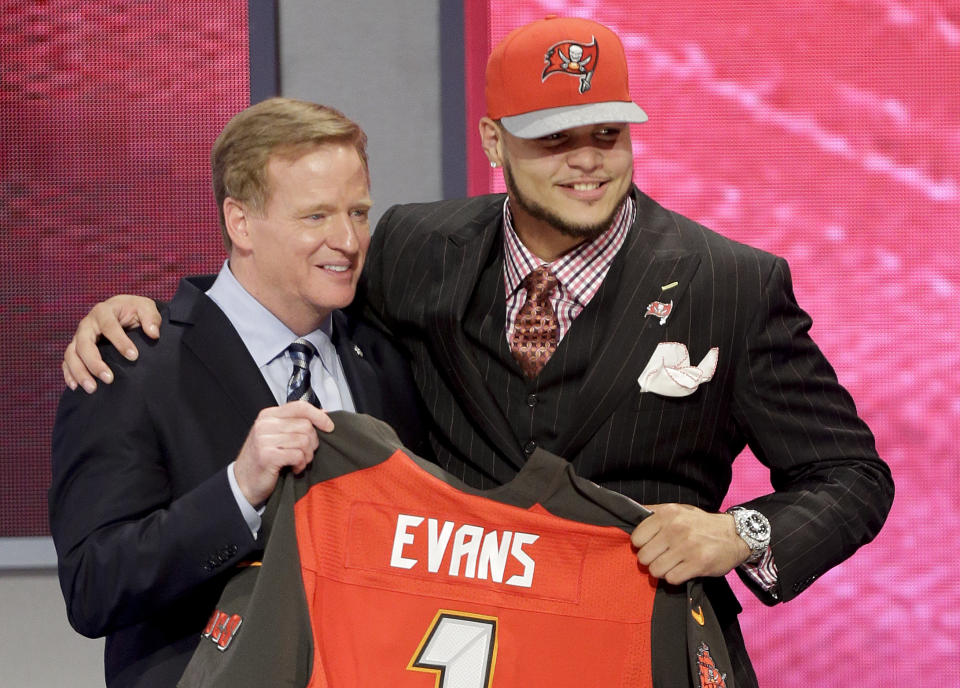 Texas A&M wide receiver Mike Evans poses with NFL commissioner after being chosen by the Tampa Bay Buccaneers as the seventh pick in the first round of the 2014 NFL Draft, Thursday, May 8, 2014, in New York. (AP Photo/Frank Franklin II)