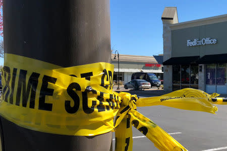 A police crime scene tape blocks off a FedEx store which is closed, with police saying it may be linked to the overnight bomb at Schertz, Texas FedEx facility, in Austin, Texas, U.S., March 20, 2018. REUTERS/Jon Herskovitz
