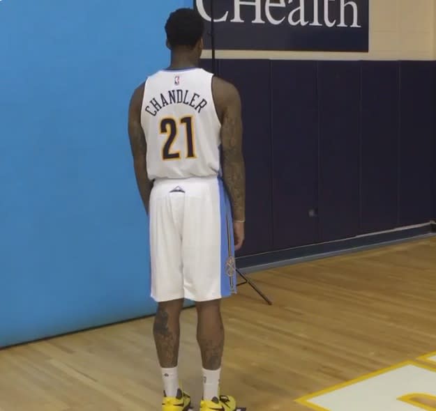 <p>Wilson Chandler gets caught watching the paint dry. (@nuggets on Twitter) </p>