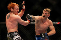 ATLANTA, GA - APRIL 21: John Alessio (R) punches Mark Bocek during their lightweight bout for UFC 145 at Philips Arena on April 21, 2012 in Atlanta, Georgia.