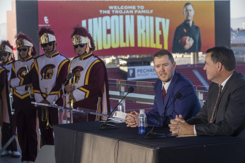 New USC football coach Lincoln Riley and athletic director Mike Bohn speak at a press conference