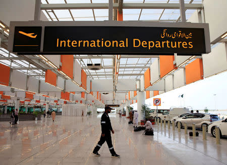 A worker walks at the departure area of the newly built Islamabad International Airport, during a media tour ahead of its official opening, Pakistan April 18, 2018. REUTERS/Faisal Mahmood