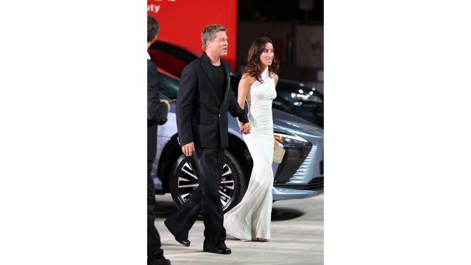 Brad Pitt and Ines de Ramon attend the "Wolfs" red carpet during the 81st Venice International Film Festival 